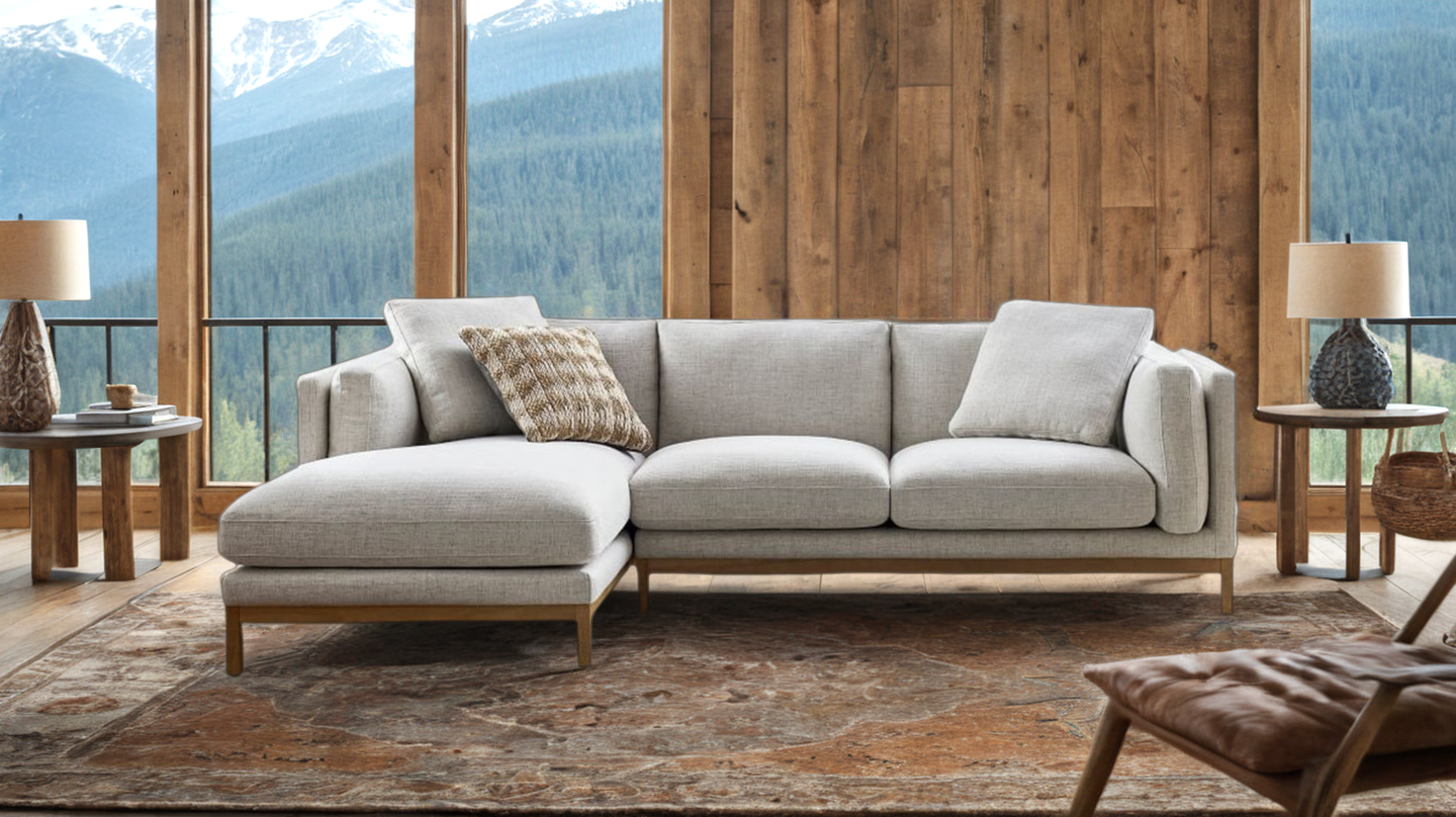 A photorealistic AI generated image of a couch in a lodge-style room in front of windows overlooking a mountain scene.